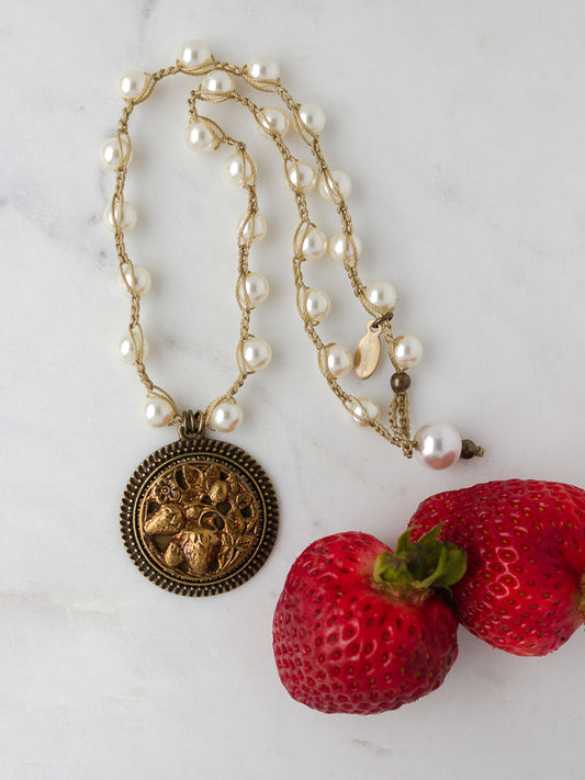 An antique strawberry button becomes a lovely pearl necklace