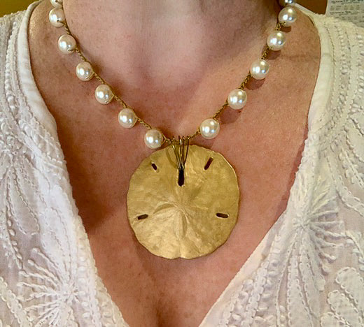 A Bahamas vacation, beach wedding, and a sand dollar necklace