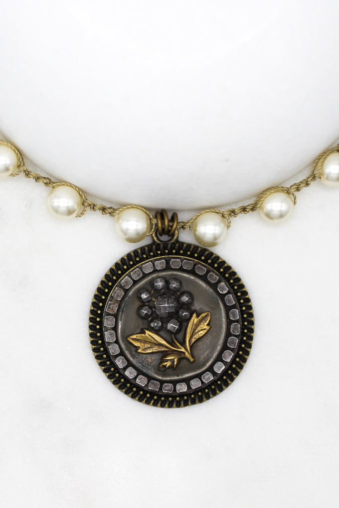 antique button necklace with black flower and gold leaves