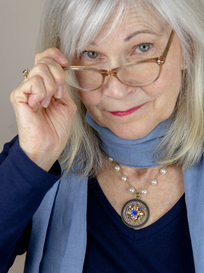 wearing sapphire blue vintage pearl necklace with blue scarf