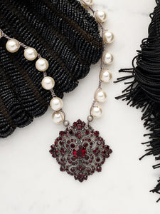 Vintage garnet brooch repurposed into pearl necklace