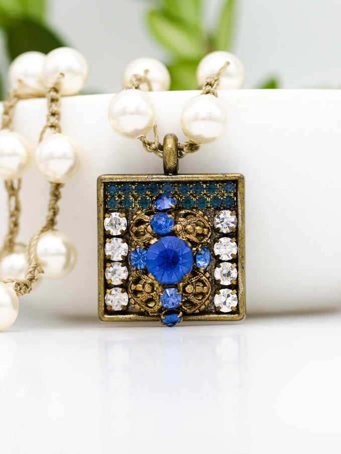 What Do British Mysteries and a Royal Blue Vintage Square Pendant Have in Common?