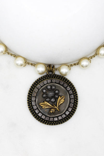 antique button necklace with black flower and gold leaves