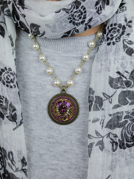 amethyst rhinestone necklace with pearls worn with black flowered scarf